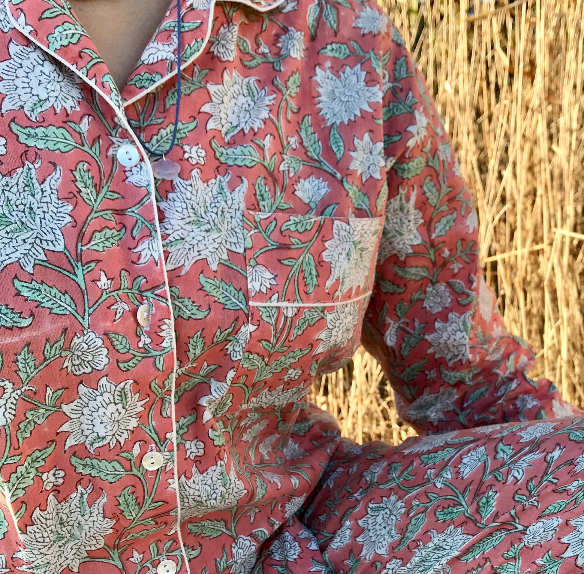 Woman wearing rose cotton pyjama with floral design
