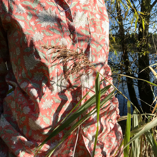 Woman wearing rose cotton pyjama with floral design