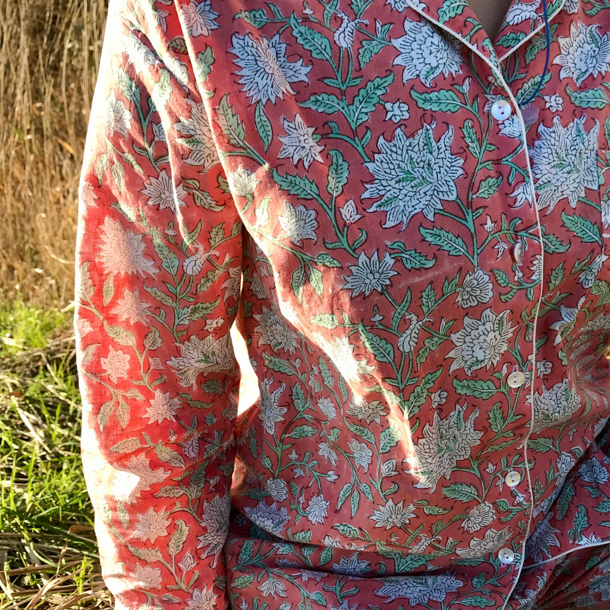 Woman wearing rose cotton pyjama with floral design