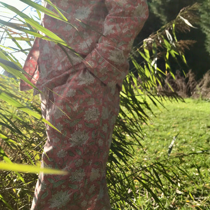 Woman wearing rose cotton pyjama with floral design