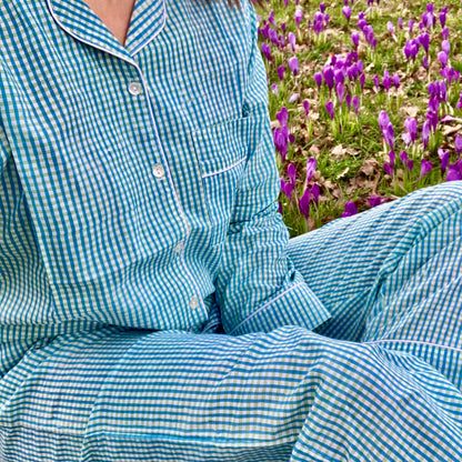 woman wearing cotton pyjama with blue green stripes